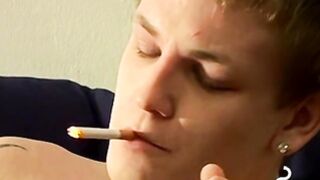 Tomy cant help rubbing his throbbing shaft while smoking