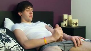 Emo twink enjoys covering his tight body with cum