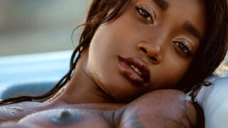 Black hot girl from Cameroon Mimi Desuka gets naked in a pool for Playboy