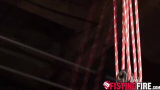 Uniformed interrogator Dirk Caber drives his fist into his helpless prisoner